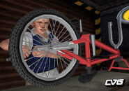 Jimmy works on a bike in Shop Class.