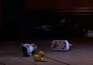 A rubber duckie lying on the floor