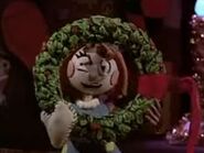 Molly with a Christmas wreath