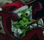 Mr Bumpy in a Santa hat riding in the sleigh