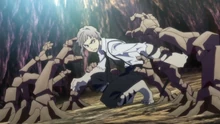Atsushi immobilized by Goncharov's stone hands.