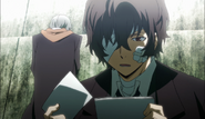 Dazai investigating the photos