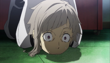 Atsushi covers the bomb with his body