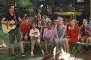 Pilot (Xander playing guitar with Tiffany, Zuri, Lou, and Emma laughing) Campfire