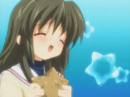 Fuko in Let's Find Friends daydreaming with a starfish in her hands.