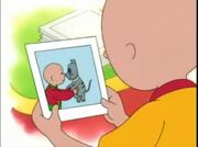 Caillou looks at a picture of himself and young Gilbert