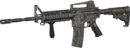 M4 Carbine with Woodland camouflage.