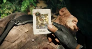 Naga holding his bounty card.