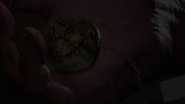 Menendez's Locket in his hand.