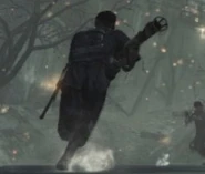 A German soldier runs with a Panzerschreck.