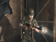 A German soldier fires his MP40 during house-to-house fighting.