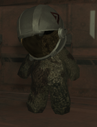 A teddy bear wearing a helmet in Moon.