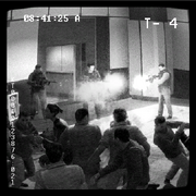 Security camera footage of Makarov's team shooting into a crowd of civilians at Zakhaev International Airport. Allen is not shown.