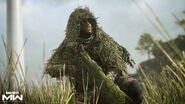 Price wearing a Ghillie Suit.