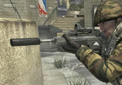 Famas that is equipped with Red Dot Sight and Silencer, in third person