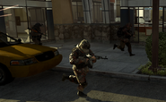 Ground Force troopers file out of a building.