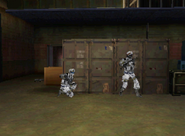 Vargas and Brewer in front of a large crate that contains Russian equipment in "Overwatch".