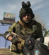 Al-Qatala wearing a Russian helmet with NVGs