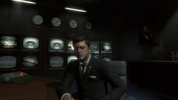 John Kennedy at table.png
