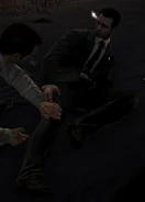 A FSO agent helps a wounded comrade.