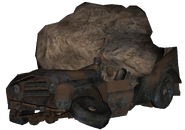 A UAZ-3151 having been crushed by rock.