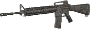M16A4 with Woodland camouflage.