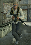 A Militia gunman wearing a bandolier and using a FAL.