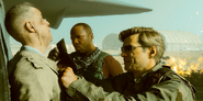 Gusev being interrogated by Adler, William "Case" Calderon and Lawrence Sims.