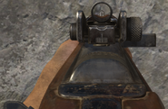 Aiming down the M1A1 Carbine's iron sights.