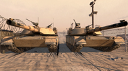 Two Abrams tanks parked in "S.S.D.D.".