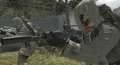 Third person view of the Commando that has Reflex Sight and Suppressor attached