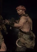 A Viet Cong guard holding an AK-47 with an ACOG Scope scope.