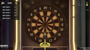 Playing a game of Darts.