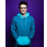 Michael Jones modeling the Camp Camp Max Cosplay Hoodie