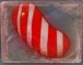 A red vertical striped candy in marmalade