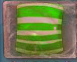 A green horizontal striped candy in marmalade