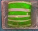 A green horizontal striped candy in marmalade