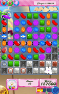 Mobile level 562: A purple fish is about to eat a green bomb while there are more jellies.