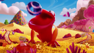 Candy frog consuming a striped candy