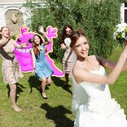 Bubblegum Troll in bride throwing bouquet