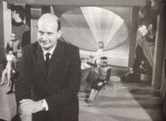 Gerry Anderson on set. Behind him are two members of the Spectrum band