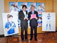 Takahashi and Ogura presenting Soccer Shojo Kaede