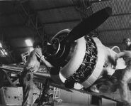 Men from ATAIU working on a Japanese Oscar (XJ002) inside Hangar 7 at Eagle Farm Airfield in Brisbane, Australia in 1944 via http://www.hangar7.org.au/