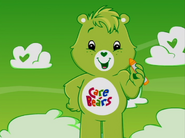 Oopsy with the Care Bears logo on with belly, from the opening song