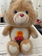 Birthday Bear's belly badge on Tenderheart Bear