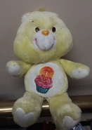 Birthday Bear with no tongue and a tilted and off-center belly badge