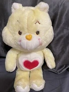 Tenderheart Bear's Belly Badge on Birthday Bear, considered a variant of I Love You Bear