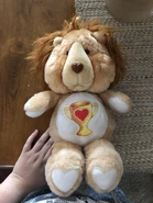 Champ Bear's Belly Badge on Brave Heart Lion