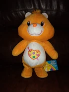 Chinese, fully-orange walking Work of Heart Bear with a Funshine tag, likely by Sunasia Enterprise