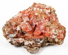 Bright, cherry-red Gypsum crystals 2.5 cm in height are colored by rich inclusions of the rare species Botrygen.